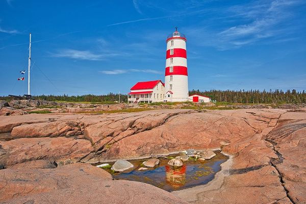 Canada-Quebec-Pointe-des-Monts Lighthouse on shore of St Lawrence River
